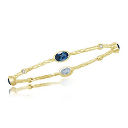 0.20 Cts Diamond & 5.32 Cts London Blue Topaz Hammered Bangle in 14K Yellow Gold
