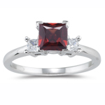 0.20 Cts Diamond & 2.99 Cts Garnet Classic Three Stone Ring in Platinum