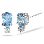 0.02 Ct Diamond & 6x4 Oval Swiss Blue Topaz Stud Earrings in 14KW Gold